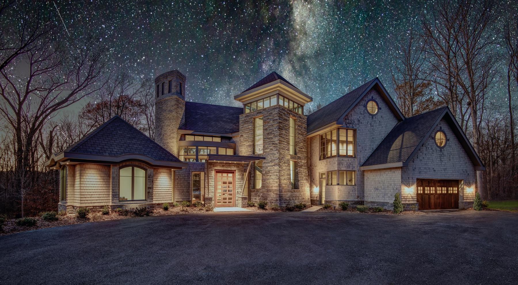 A custom home built by Great Falls Construction at twilight